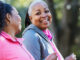 Two women exercising outdoors, losing weight to fight diabetes.