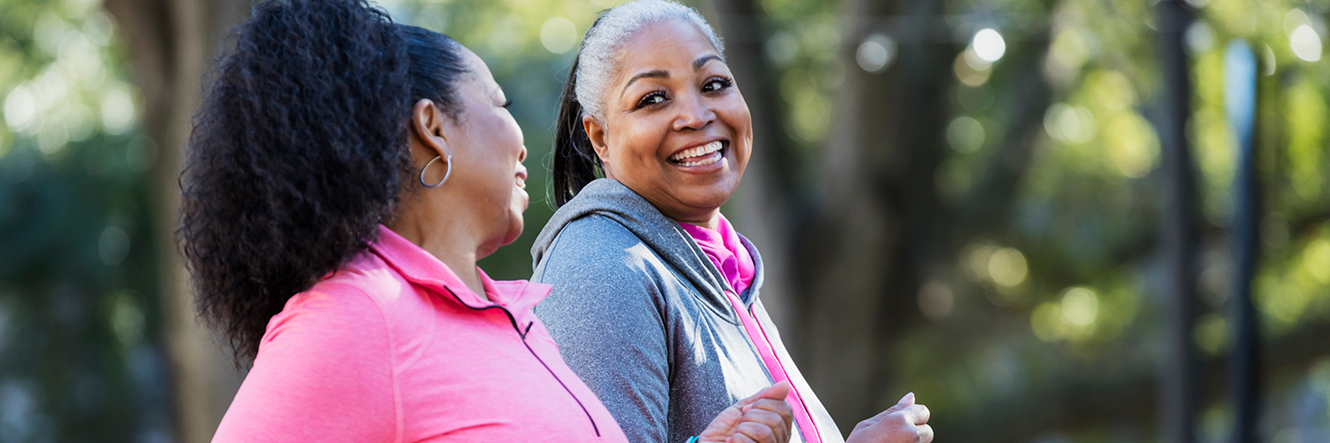 Two women exercising outdoors, losing weight to fight diabetes.