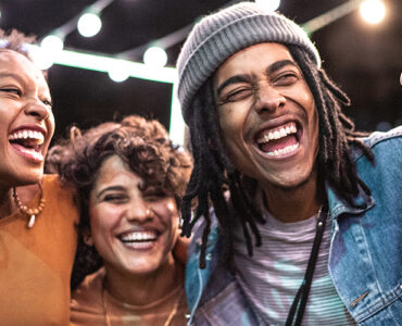 A group of friends supporting each other on National Coming Out Day.