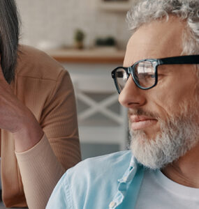 A husband and wife looking over the best prostate cancer treatments available in early stages.