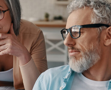 A husband and wife looking over the best prostate cancer treatments available in early stages.