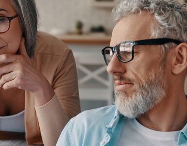 A husband and wife looking over the best prostate cancer treatments available in early stages.