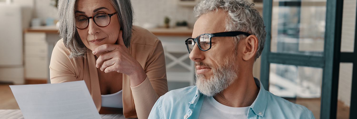 A husband and wife looking over the best prostate cancer treatments available in early stages.