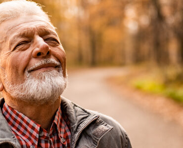 A man taking a walk alone, finding healthy ways to cope with his grief and strong emotions.