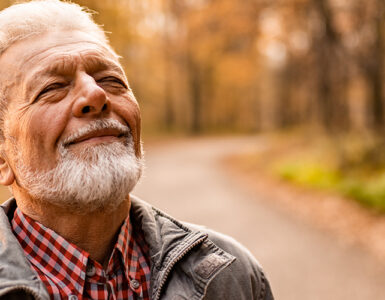 A man taking a walk alone, finding healthy ways to cope with his grief and strong emotions.