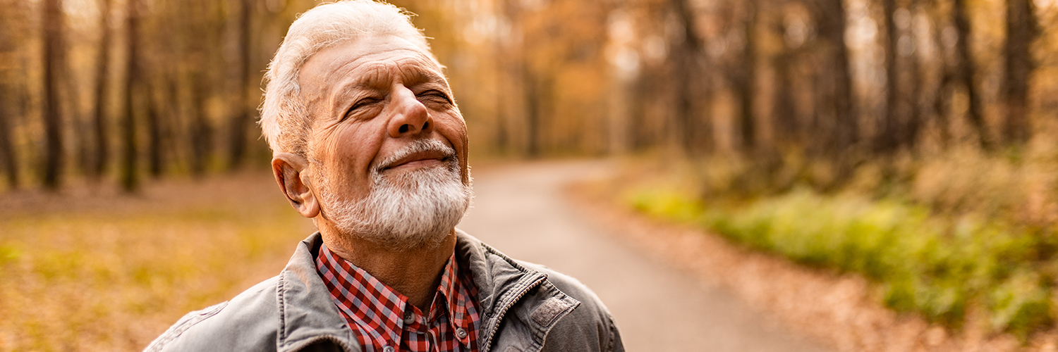 A man taking a walk alone, finding healthy ways to cope with his grief and strong emotions.