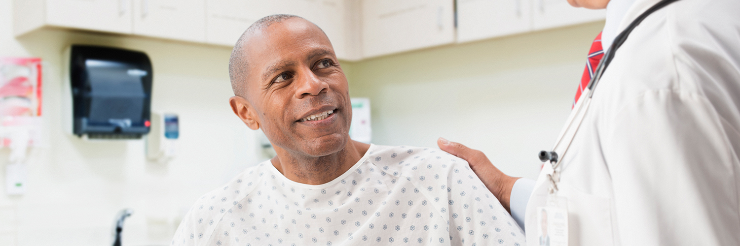 A man at his doctor's office discussing his lung cancer screening.