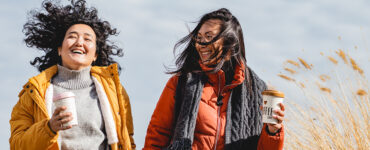 Two women getting exercise outdoors as part of their New Year's resolutions.