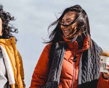 Two women getting exercise outdoors as part of their New Year's resolutions.