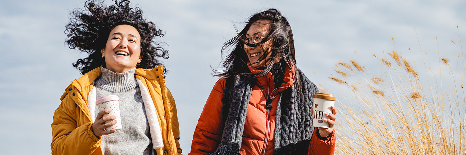 Two women getting exercise outdoors as part of their New Year's resolutions.