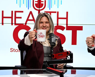 Alzheimer's experts from Stony Brook Medicine smiling with branded mugs in their hands in the podcast studio.