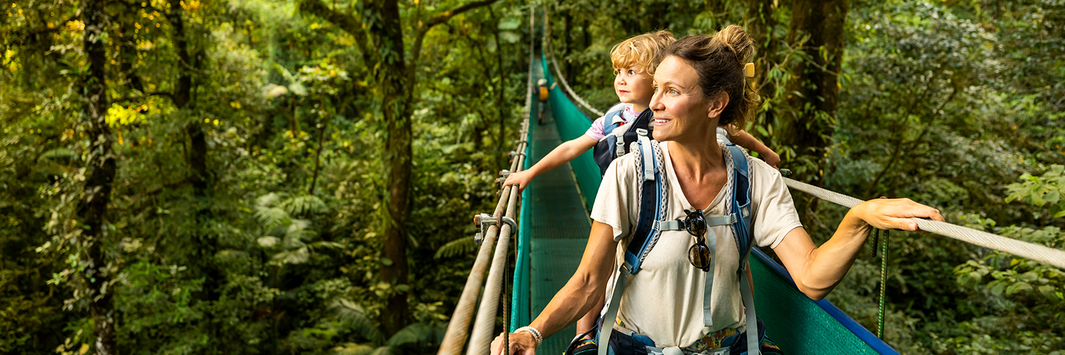A mother and her young son in a canoe, sightseeing while traveling overseas.