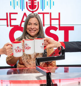 Three experts from Stony Brook Children's Hospital in the podcast studio holding coffee mugs.