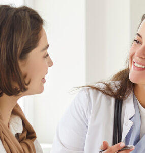 Women's doctor talking to her female patient