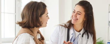 Women's doctor talking to her female patient