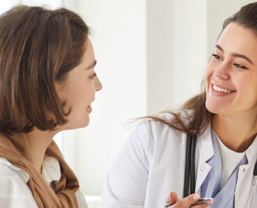 Women's doctor talking to her female patient