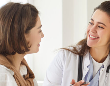 Women's doctor talking to her female patient