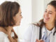 Women's doctor talking to her female patient