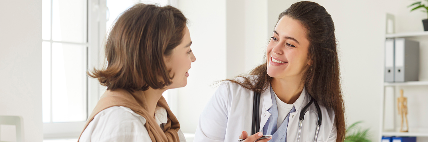 Women's doctor talking to her female patient