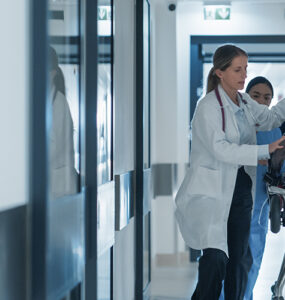 sepsis patient on gurney in hospital with ER doctors