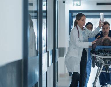 sepsis patient on gurney in hospital with ER doctors