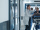 sepsis patient on gurney in hospital with ER doctors