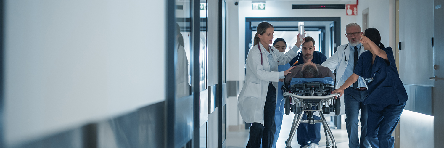 sepsis patient on gurney in hospital with ER doctors