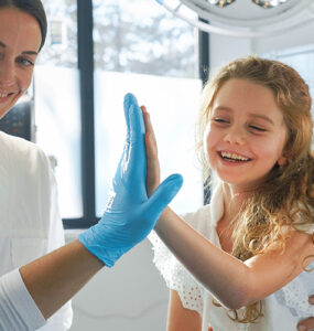 Little girl in emergency department with her mom.