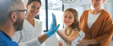 Little girl in emergency department with her mom.