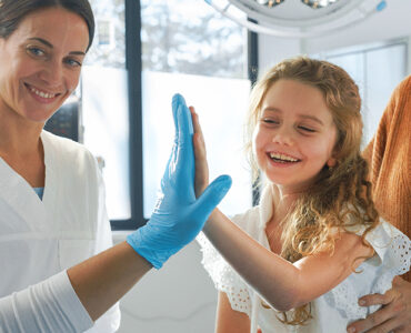 Little girl in emergency department with her mom.