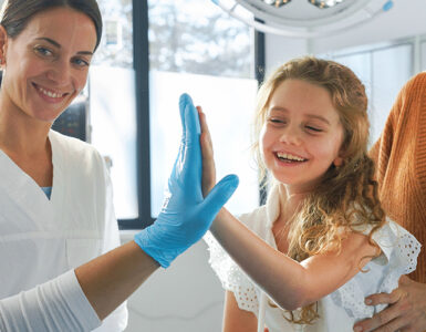 Little girl in emergency department with her mom.