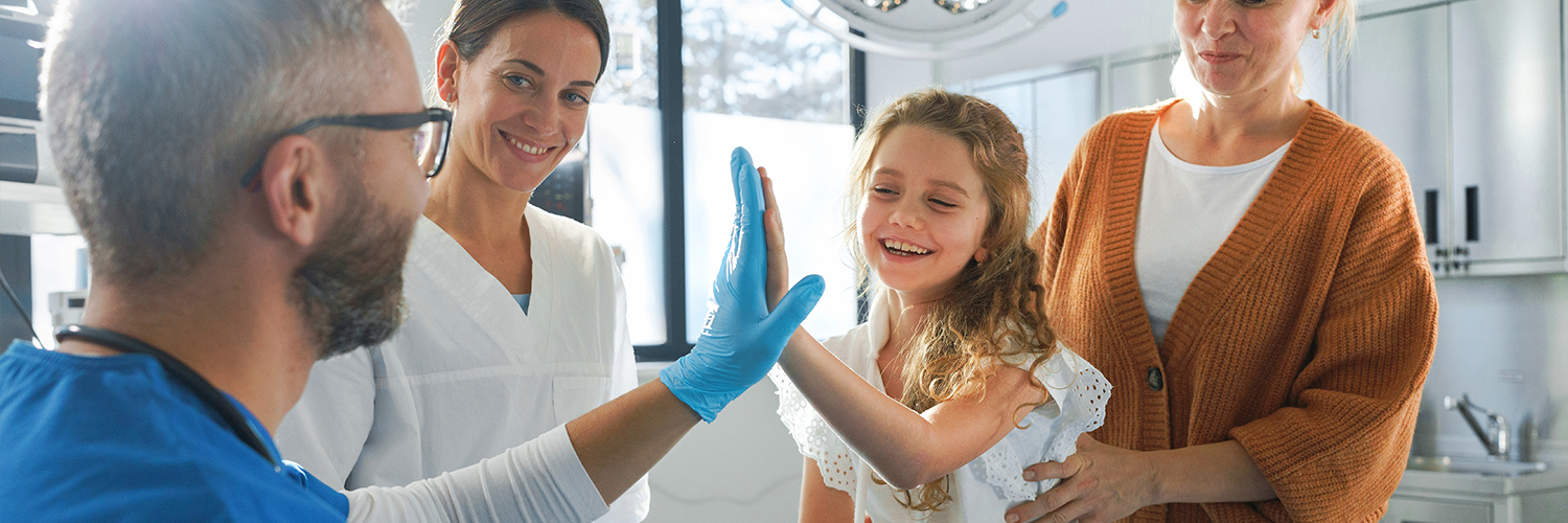 Little girl in emergency department with her mom.