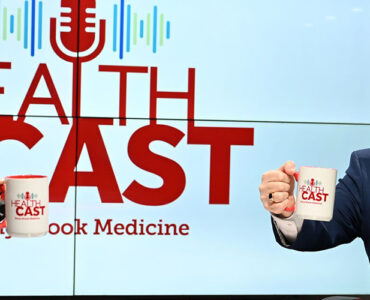 Experts from Stony Brook Medicine sitting in the podcast studio, holding up coffee mugs and smiling.