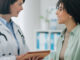 Female doctor with woman for diagnosis.