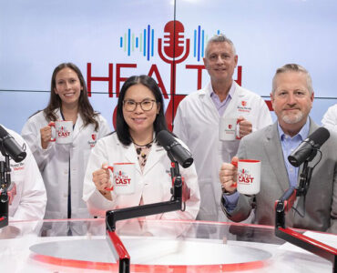 Experts from Stony Brook Medicine together in the podcast studio, holding branded coffee mugs.