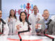 Experts from Stony Brook Medicine together in the podcast studio, holding branded coffee mugs.
